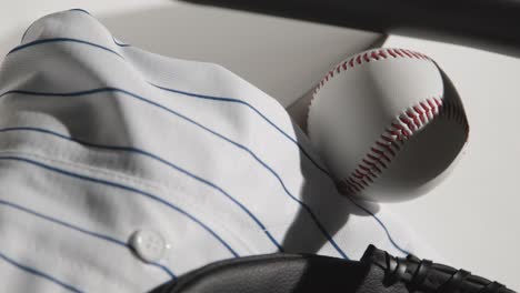 Handheld-Close-Up-Studio-Baseball-Still-Life-With-Ball-Catchers-Mitt-And-Team-Jersey